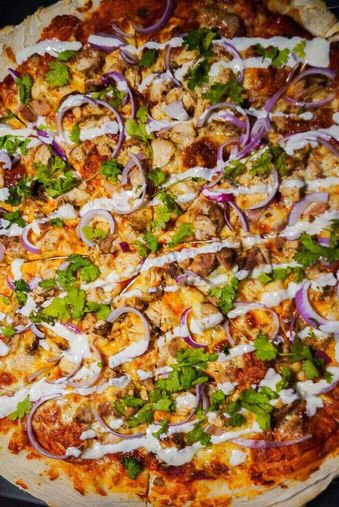 Loaded New York style pizza with fresh toppings from KICK! CHOP! SLICE! Bangkok